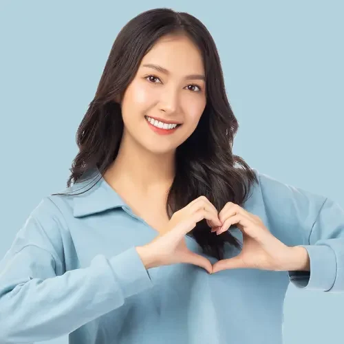 Woman making a heart shape with her hand