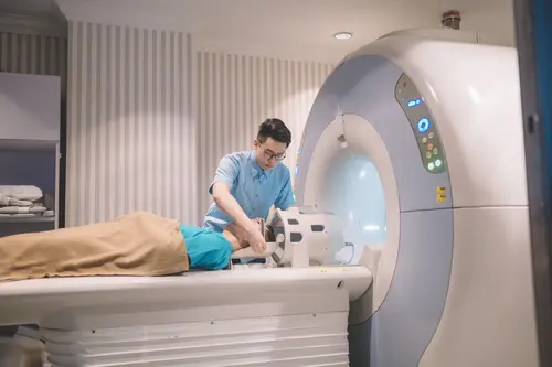 Oncologist preparing a patient for a medical imaging procedure