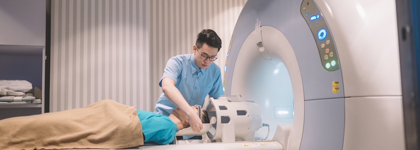Oncologist preparing a patient for a medical imaging procedure