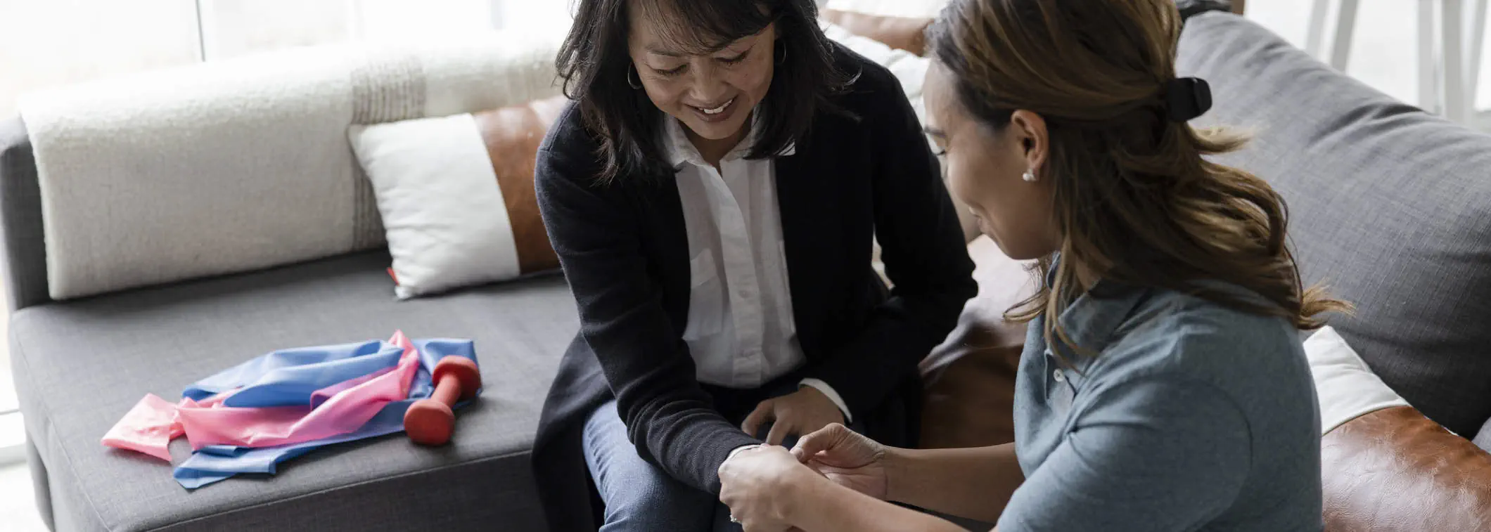 Therapist helping a patient with wrist therapy for carpal tunnel syndrome recovery