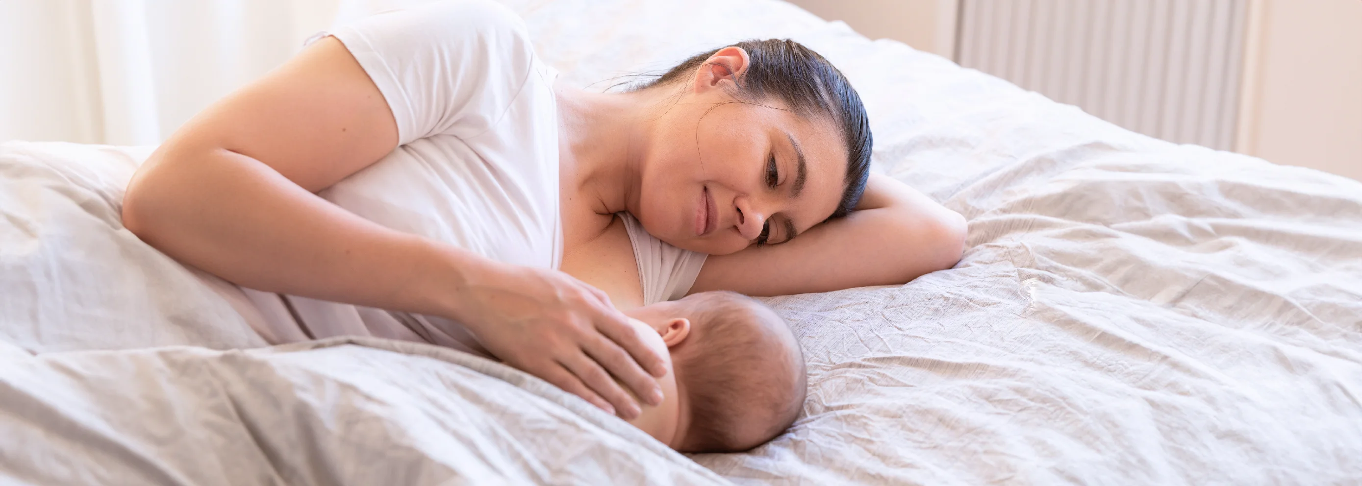 A mother and her baby, highlighting newborn care for G6PD deficiency