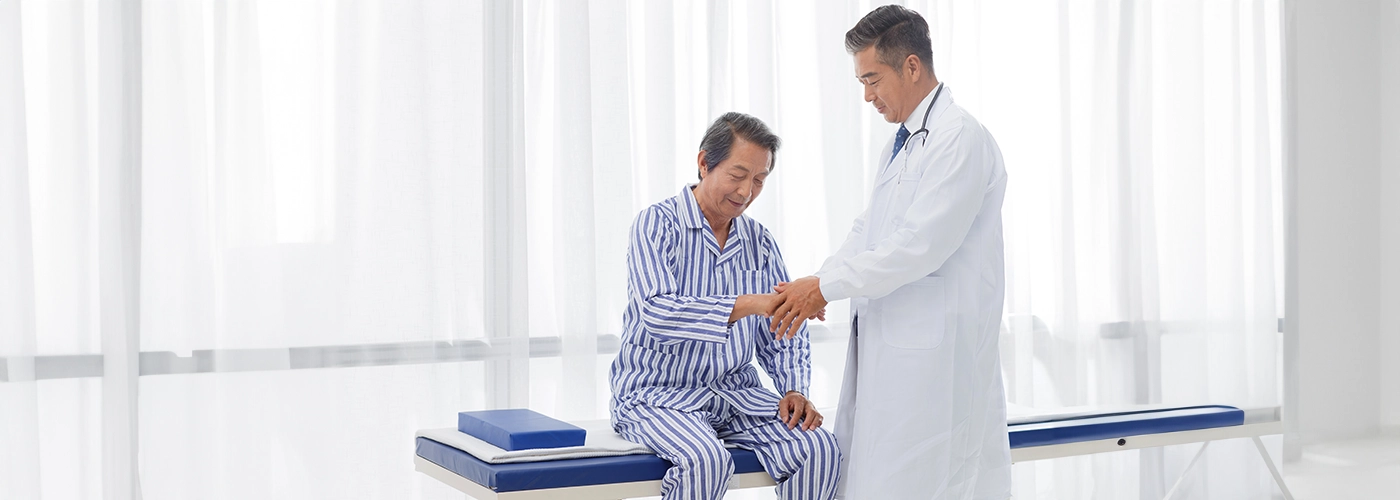 Doctor assisting patient with gout treatment