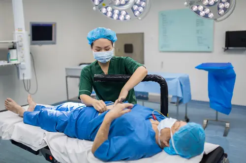 Healthcare professional preparing a patient for a gastroenterology procedure